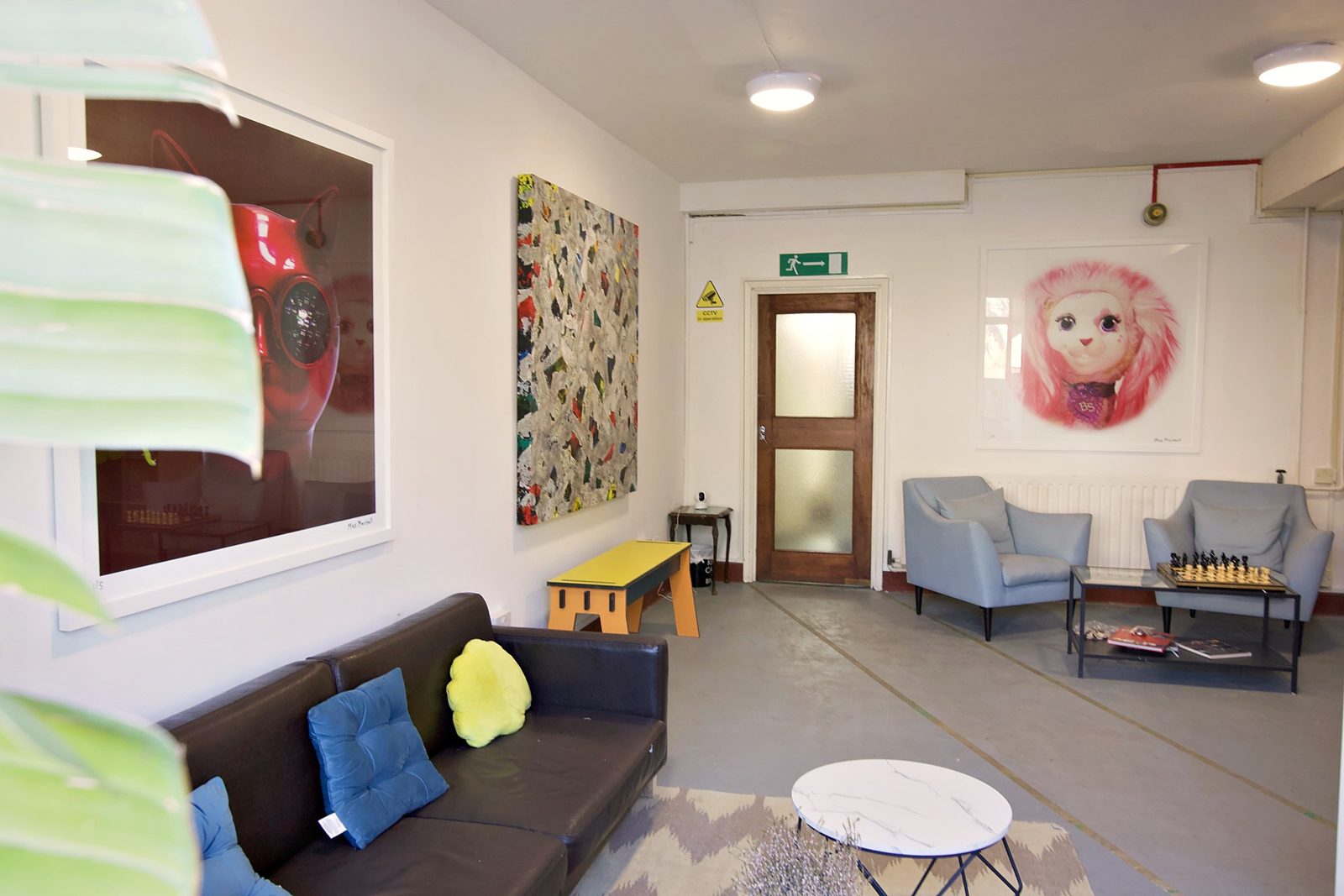 The lounge with sofas and artworks