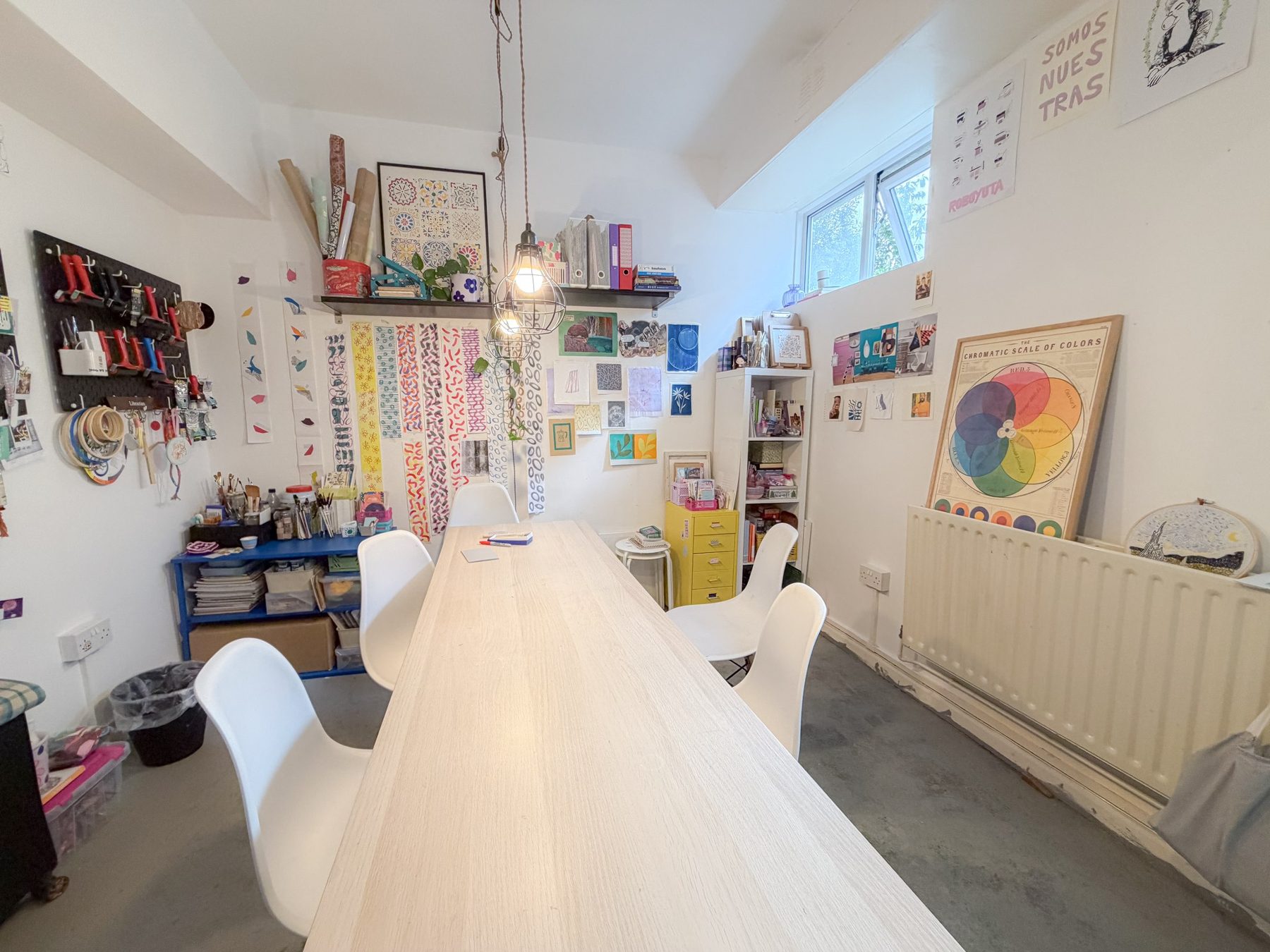 An artist's studio in use, full of work and materials